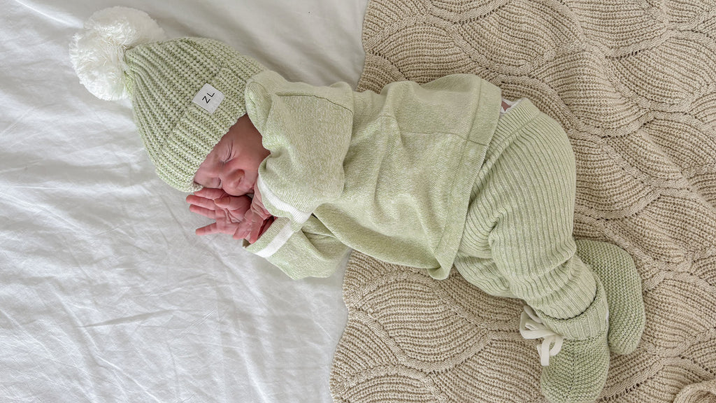 Baby wearing ZIGGY LOU Chunky Lime Sweater and Leggings whilst asleep