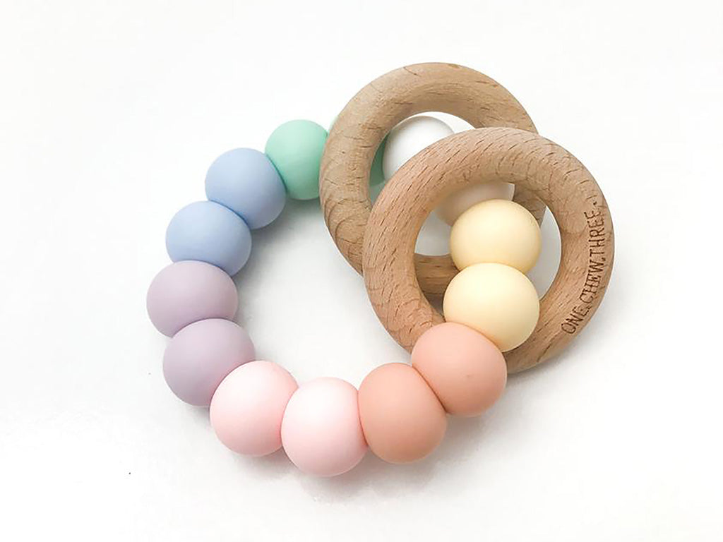 Handmade pastel rainbow teething rattle