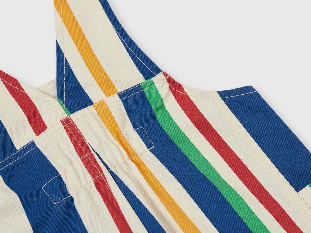 Colorful striped overalls with blue, red, yellow, and green stripes on a white background