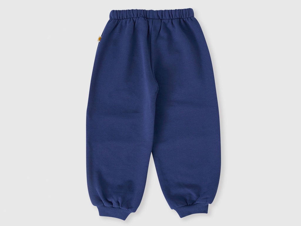Blue children's sweatpants on a light gray background