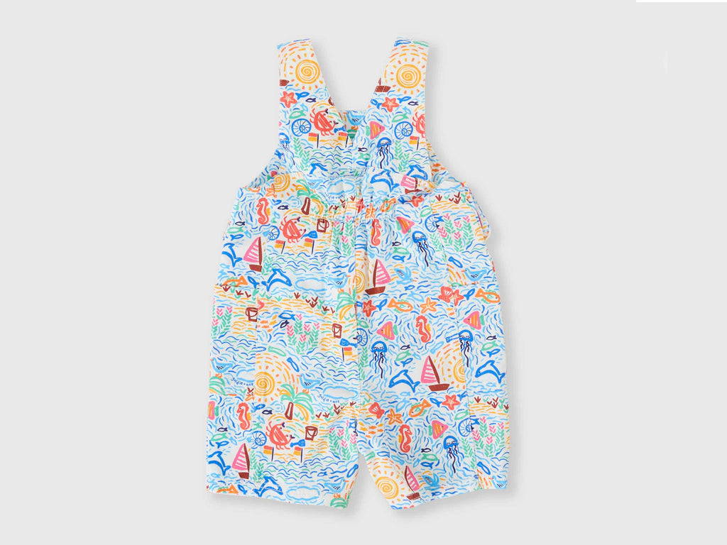 Children's overalls with a colorful sea-themed pattern on a light gray background