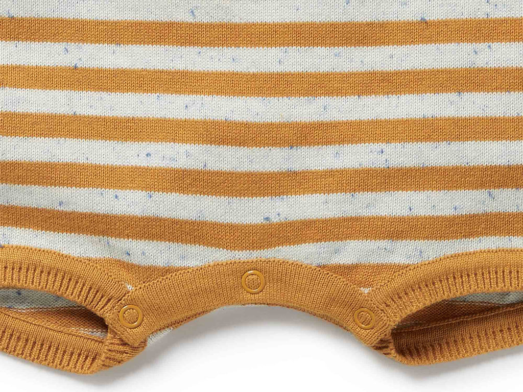 Close-up of a mustard yellow and white striped baby romper with button details on a white background.