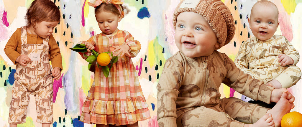 kids and babies wearing new winter kapow kids clothes on a mutli coloured artwork