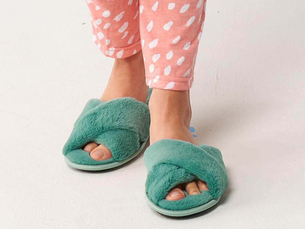 Kip and Co jade green slippers on feet