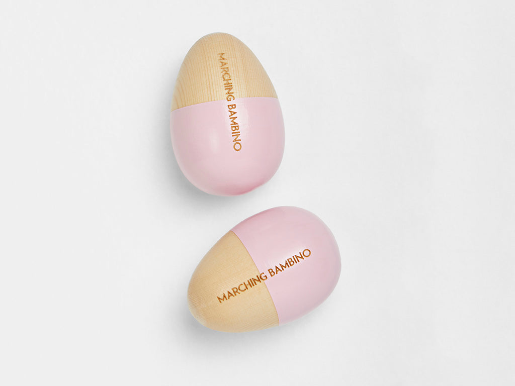 Marching bambino pink wooden egg shakers with painted tips available at young willow