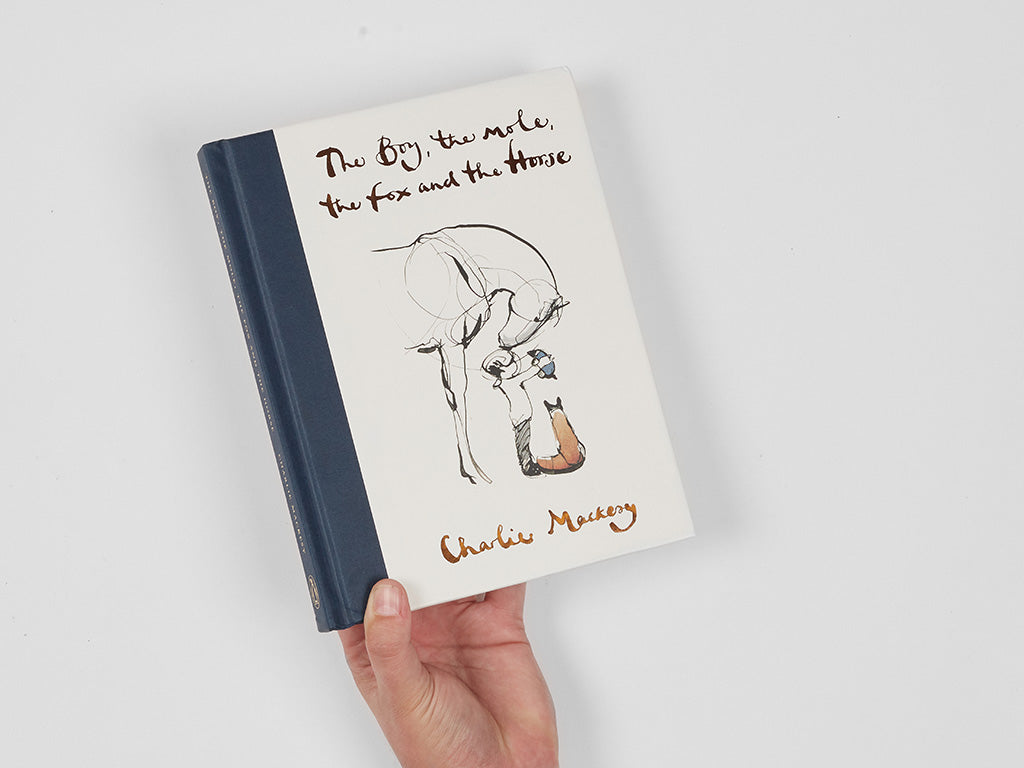 The Boy, the Mole, The Fox and the Horse Book being held